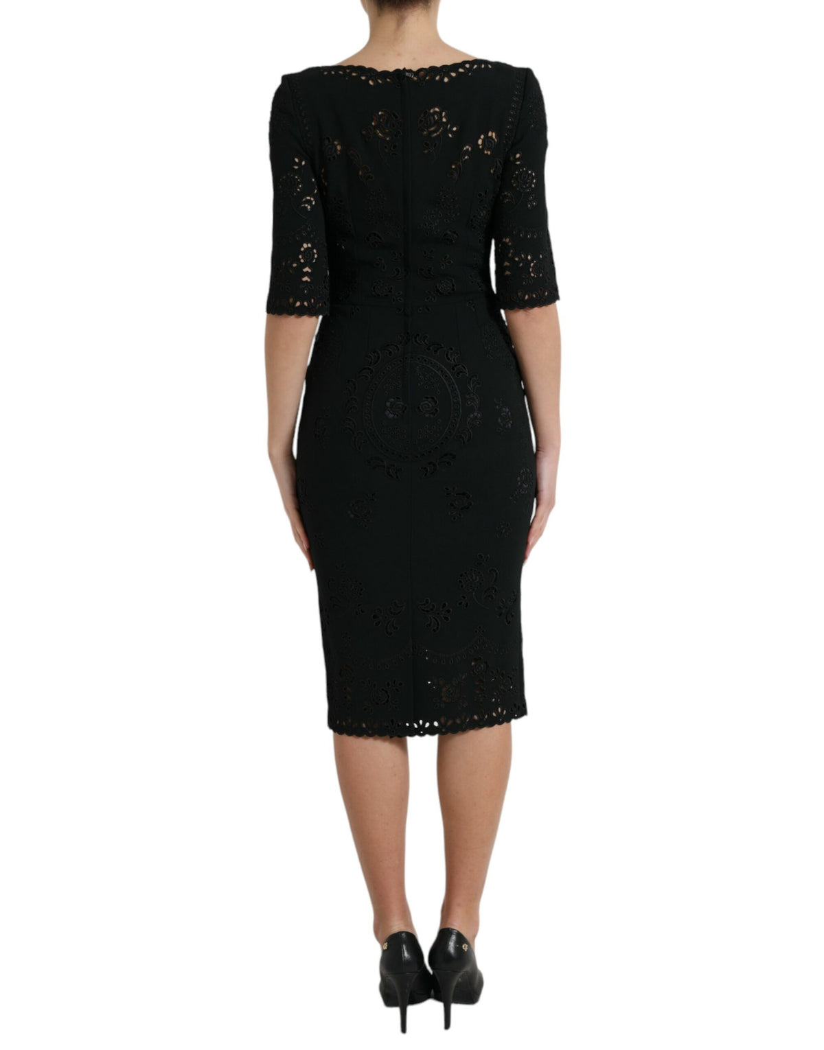 Dolce & Gabbana black floral lace viscose bodycon midi dress displayed on a hanger with intricate lace details.
