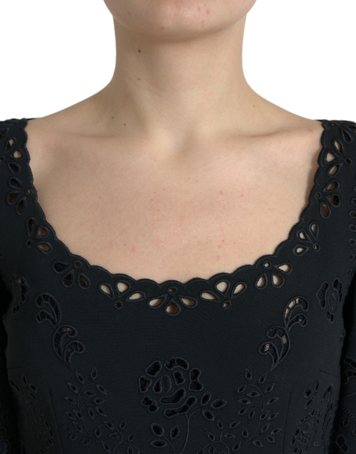 Black floral lace Dolce & Gabbana viscose bodycon midi dress displayed on hanger with intricate lace details.