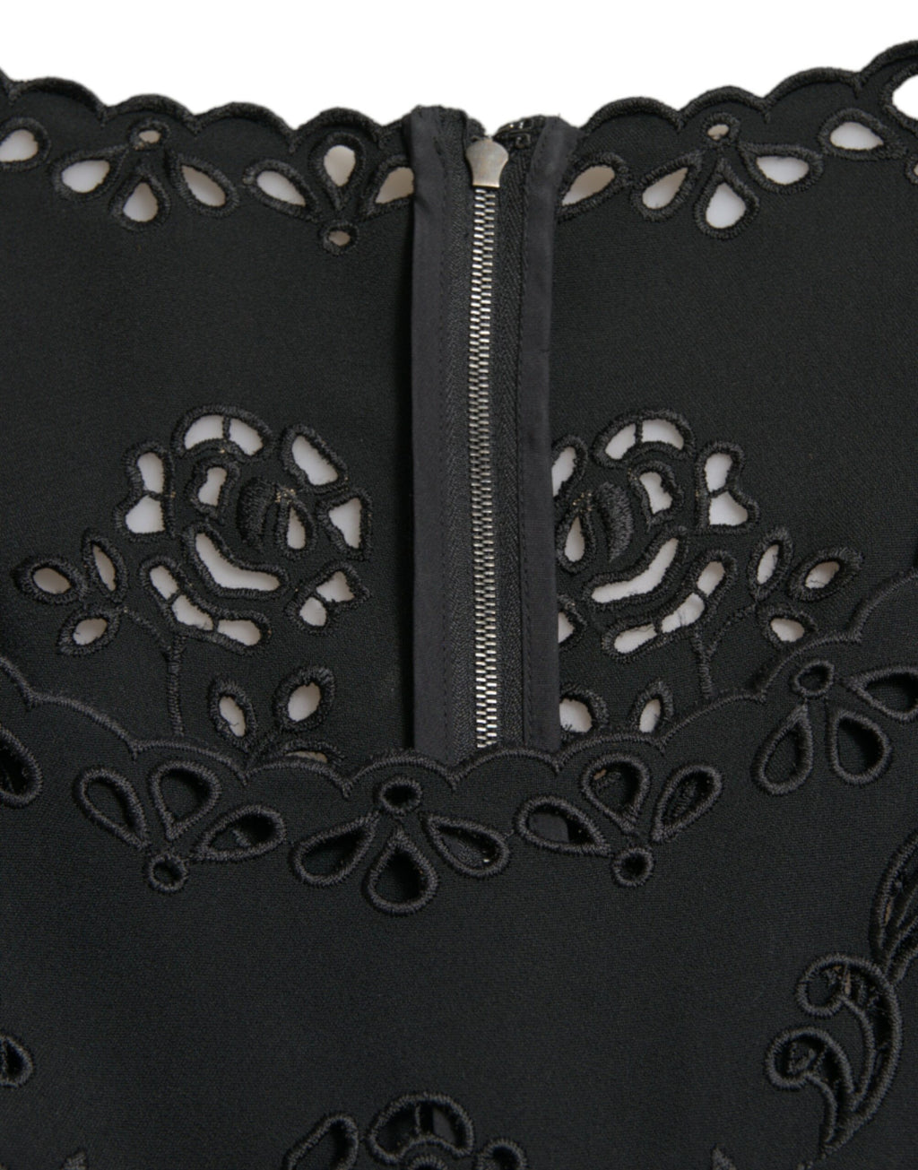 Dolce & Gabbana black floral lace viscose bodycon midi dress displayed on a hanger, showcasing its elegant floral lace pattern.