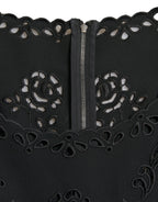 Dolce & Gabbana black floral lace viscose bodycon midi dress displayed on a hanger, showcasing its elegant floral lace pattern.
