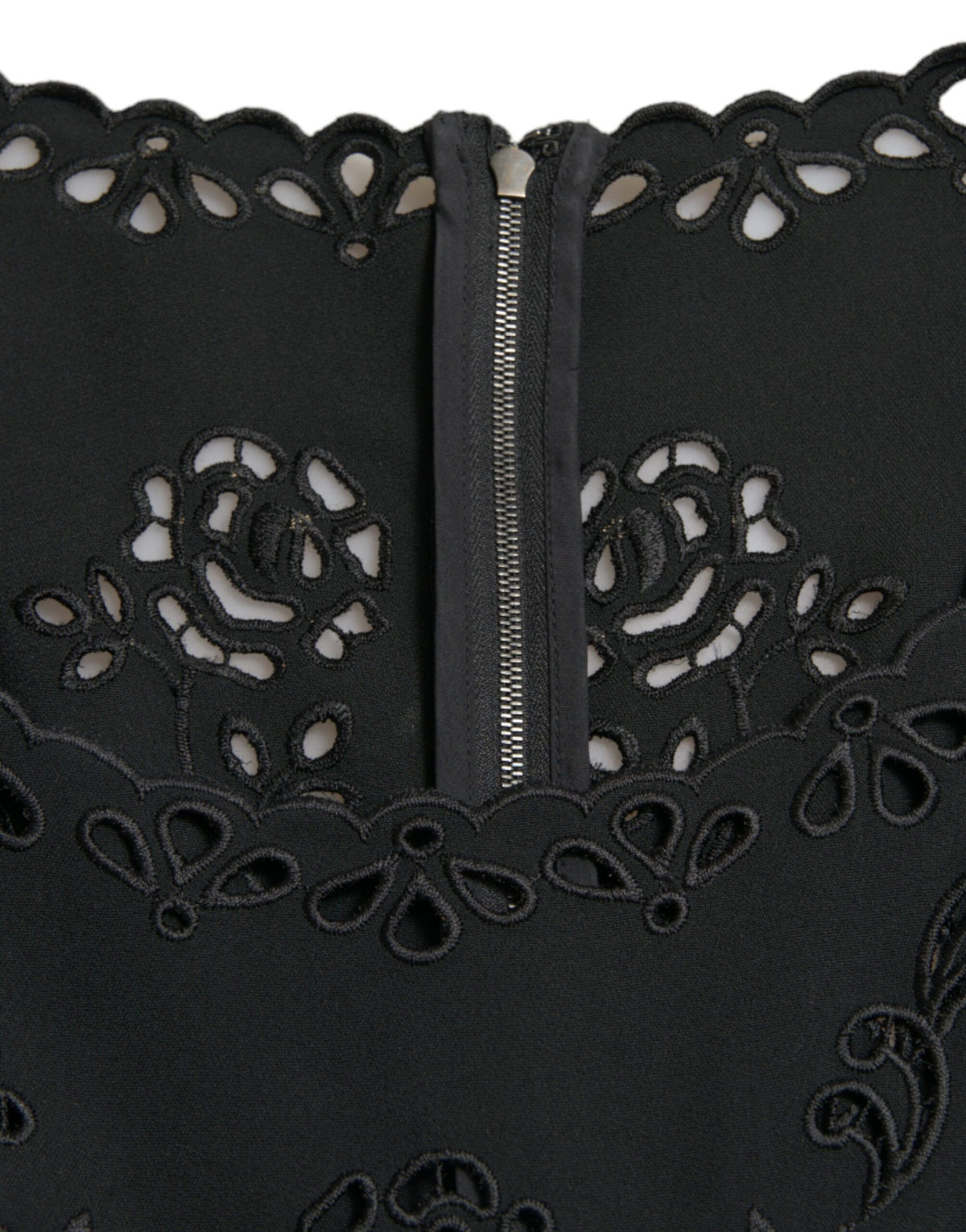 Dolce & Gabbana black floral lace viscose bodycon midi dress displayed on a hanger, showcasing its elegant floral lace pattern.