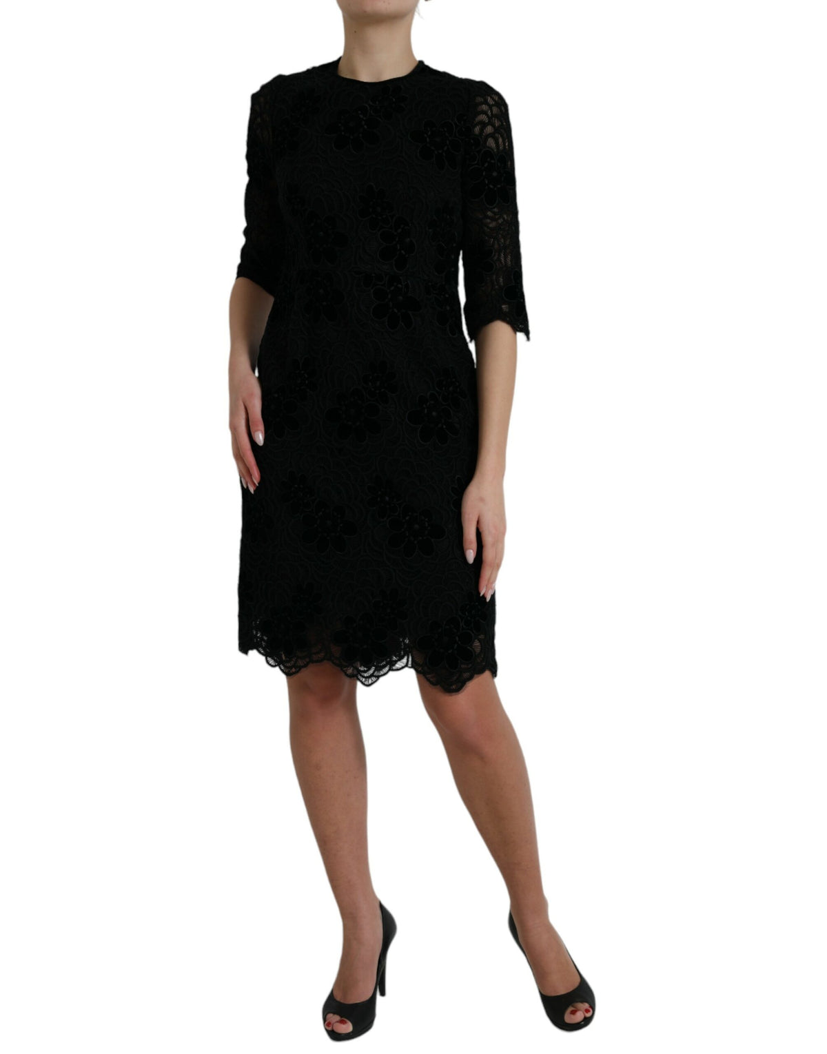 Dolce & Gabbana black floral lace cotton bodycon dress displayed on a mannequin, showcasing elegant floral lace details and fitted silhouette.