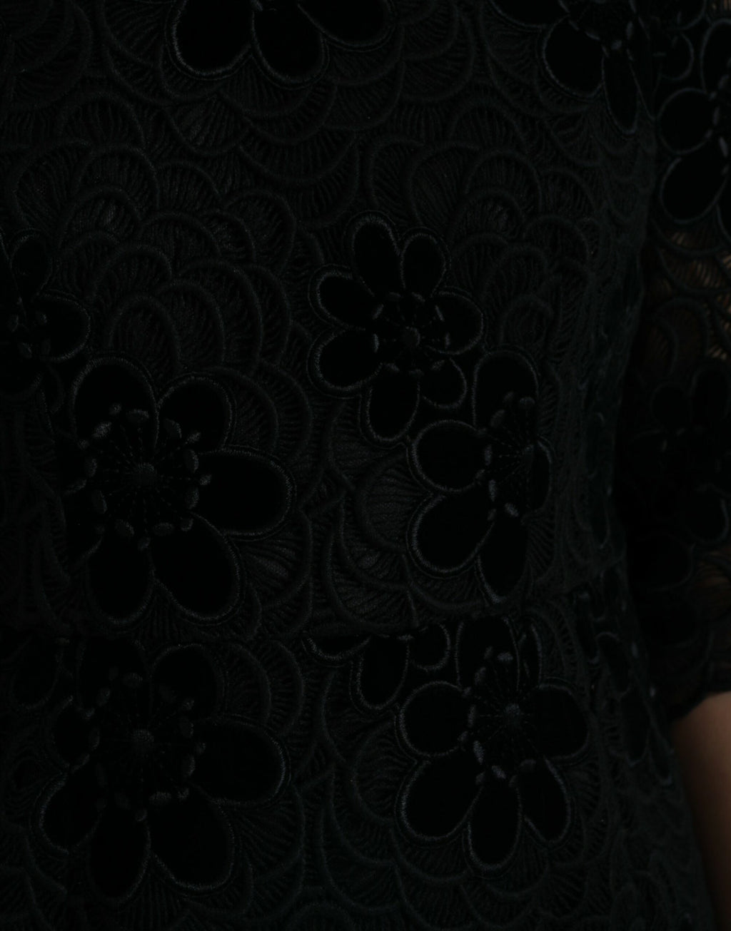 Black floral lace cotton bodycon dress by Dolce & Gabbana, featuring a fitted silhouette and intricate lace detailing.