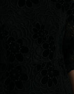 Black floral lace cotton bodycon dress by Dolce & Gabbana, featuring a fitted silhouette and intricate lace detailing.