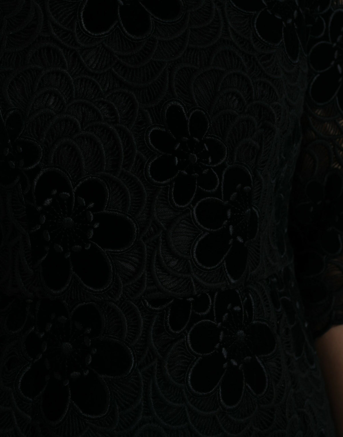 Black floral lace cotton bodycon dress by Dolce & Gabbana, featuring a fitted silhouette and intricate lace detailing.
