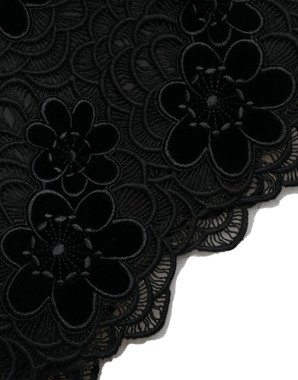 Black floral lace cotton bodycon dress by Dolce & Gabbana displayed on a hanger, showcasing intricate lace details and fitted silhouette.