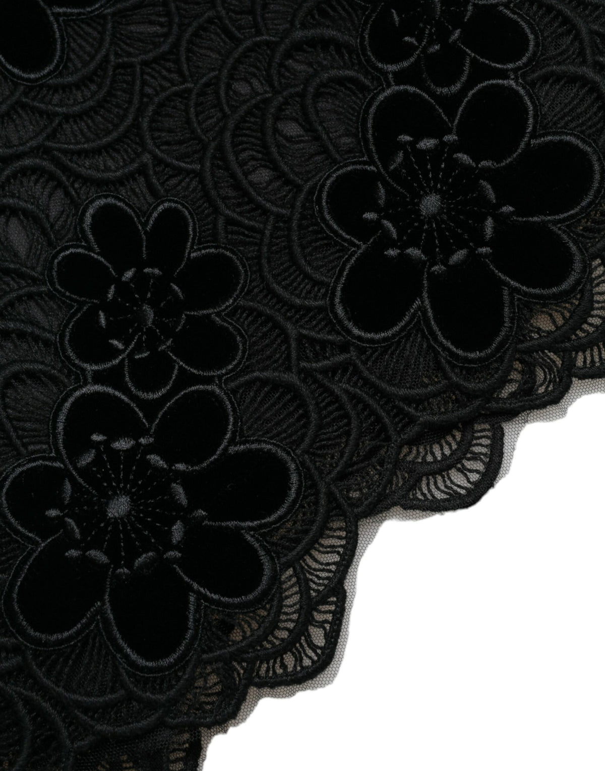 Black floral lace cotton bodycon dress by Dolce & Gabbana displayed on a hanger, showcasing intricate lace details and fitted silhouette.