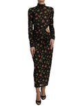 Dolce & Gabbana black floral cut-out sheath long maxi dress displayed on a hanger with intricate floral details and elegant design.