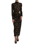 Dolce & Gabbana black floral cut-out sheath long maxi dress displayed on a hanger with intricate floral details and elegant design.