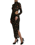 Dolce & Gabbana black floral cut-out sheath long maxi dress displayed on a hanger with intricate floral details.