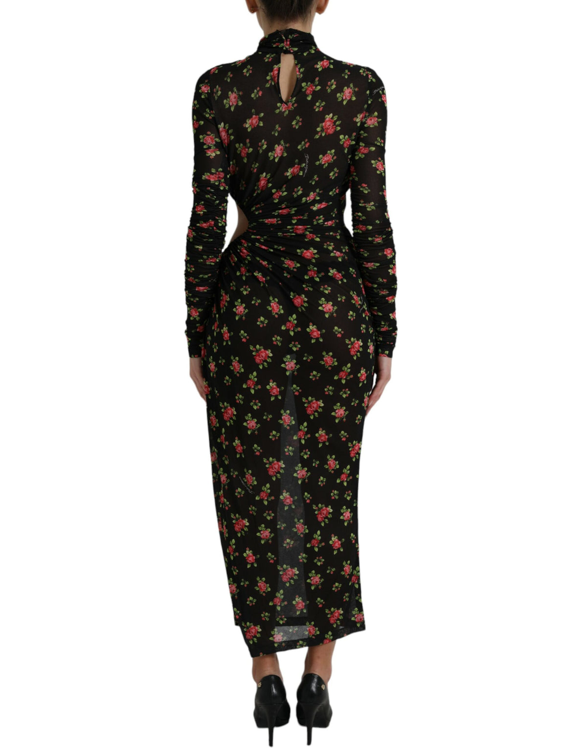 Dolce & Gabbana black floral cut-out sheath long maxi dress displayed on a hanger. Elegant evening wear with floral details and cut-out design.