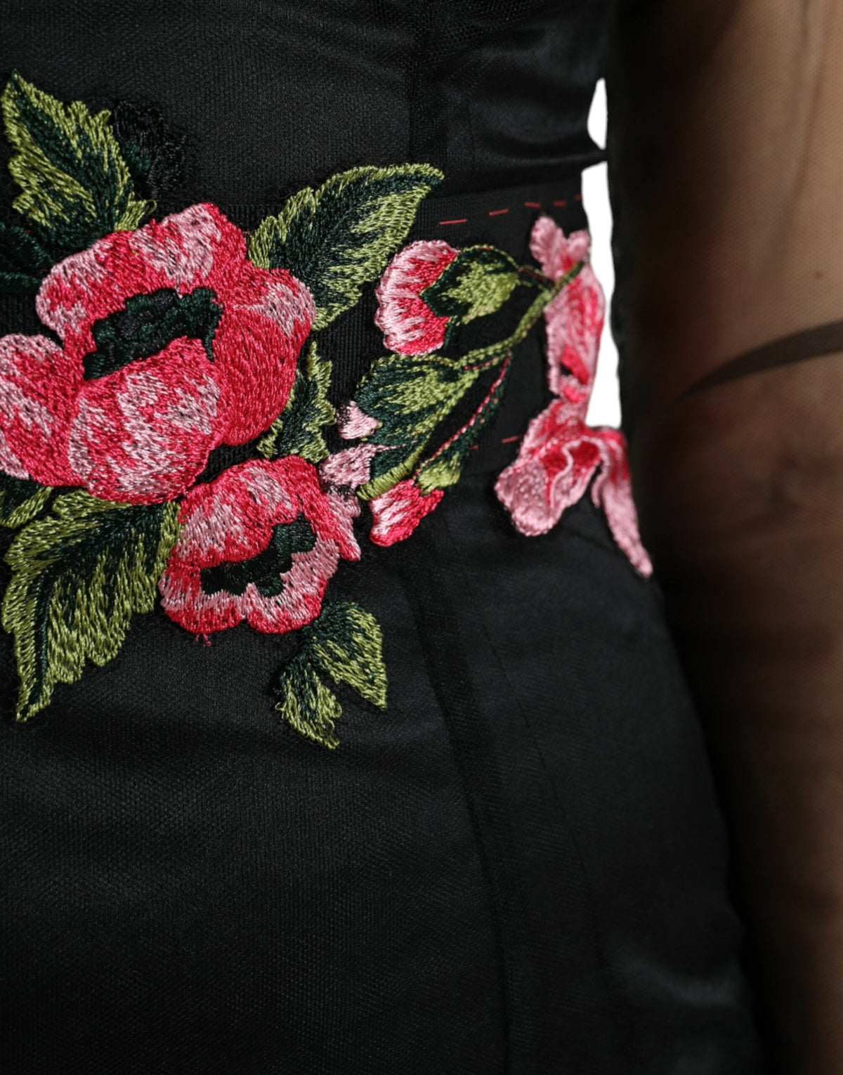 Dolce & Gabbana black floral embroidery mesh tulle gown dress displayed on a hanger, highlighting intricate embroidery and sheer fabric.