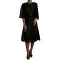 Black floral lace sheer A-line midi dress by Dolce & Gabbana with intricate lace details and elegant silhouette.