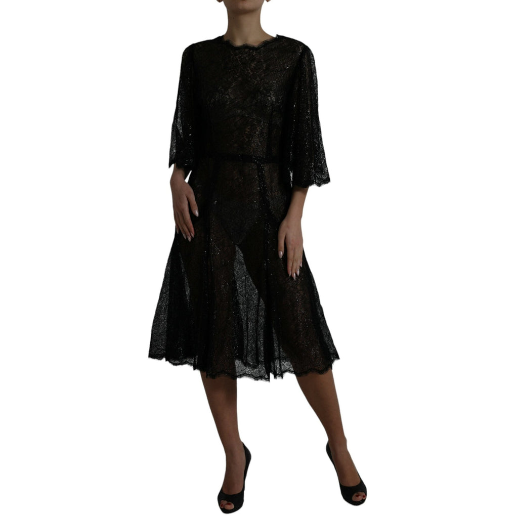 Dolce & Gabbana black floral lace sheer A-line midi dress displayed on a mannequin with intricate lace details.