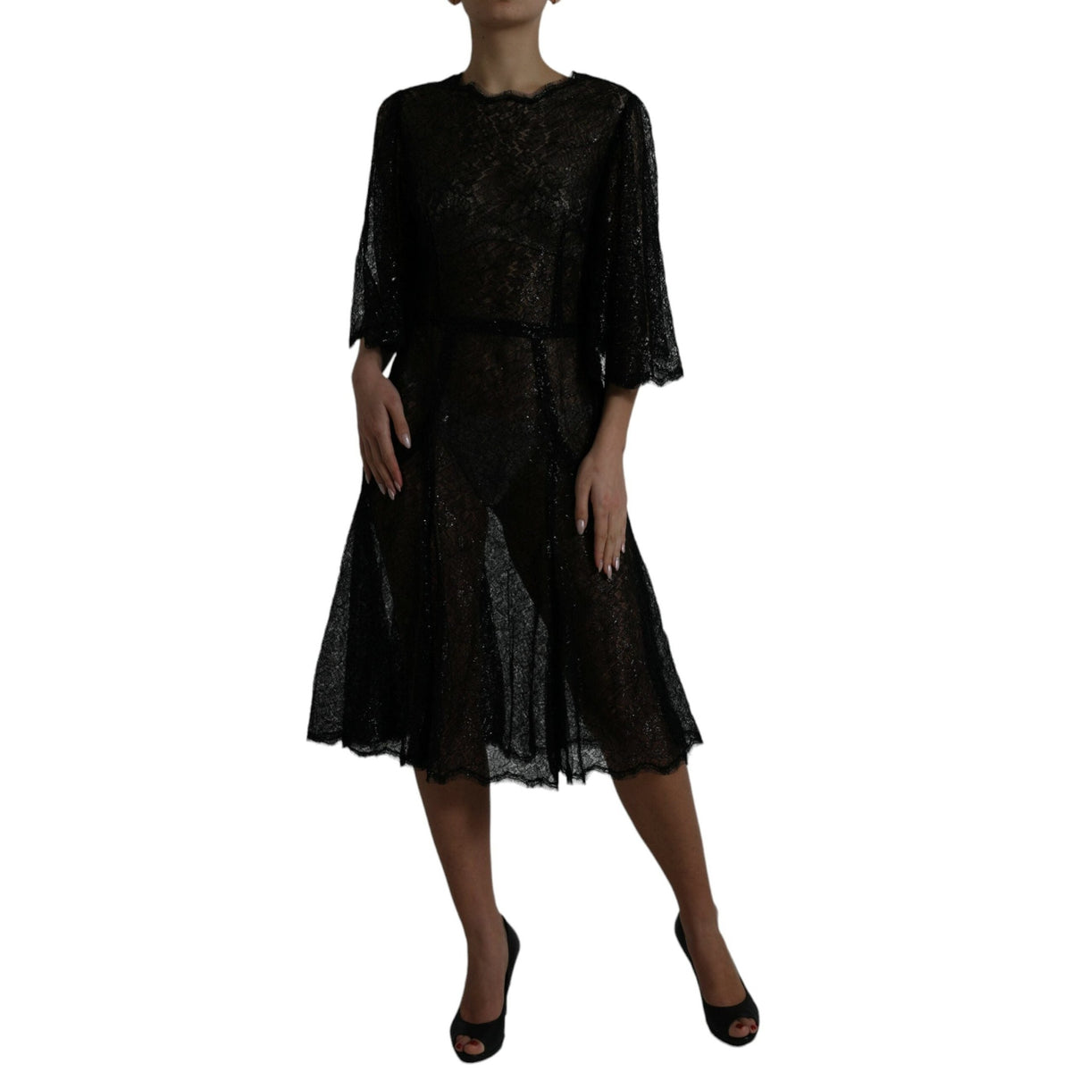 Dolce & Gabbana black floral lace sheer A-line midi dress displayed on a mannequin with intricate lace details.