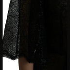 Dolce & Gabbana black floral lace sheer A-line midi dress with intricate lace details and elegant silhouette.