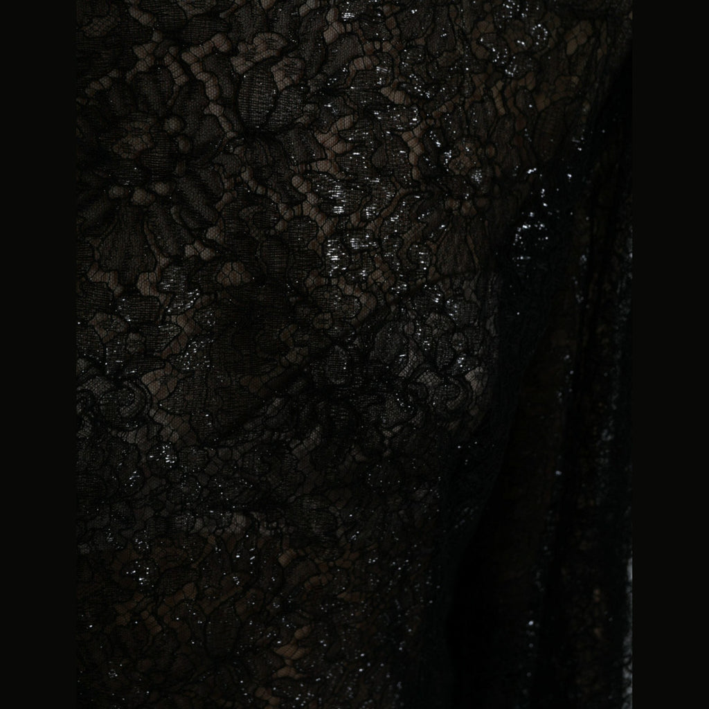 Black floral lace Dolce & Gabbana A-line midi dress with sheer fabric and elegant floral details, perfect for formal occasions.