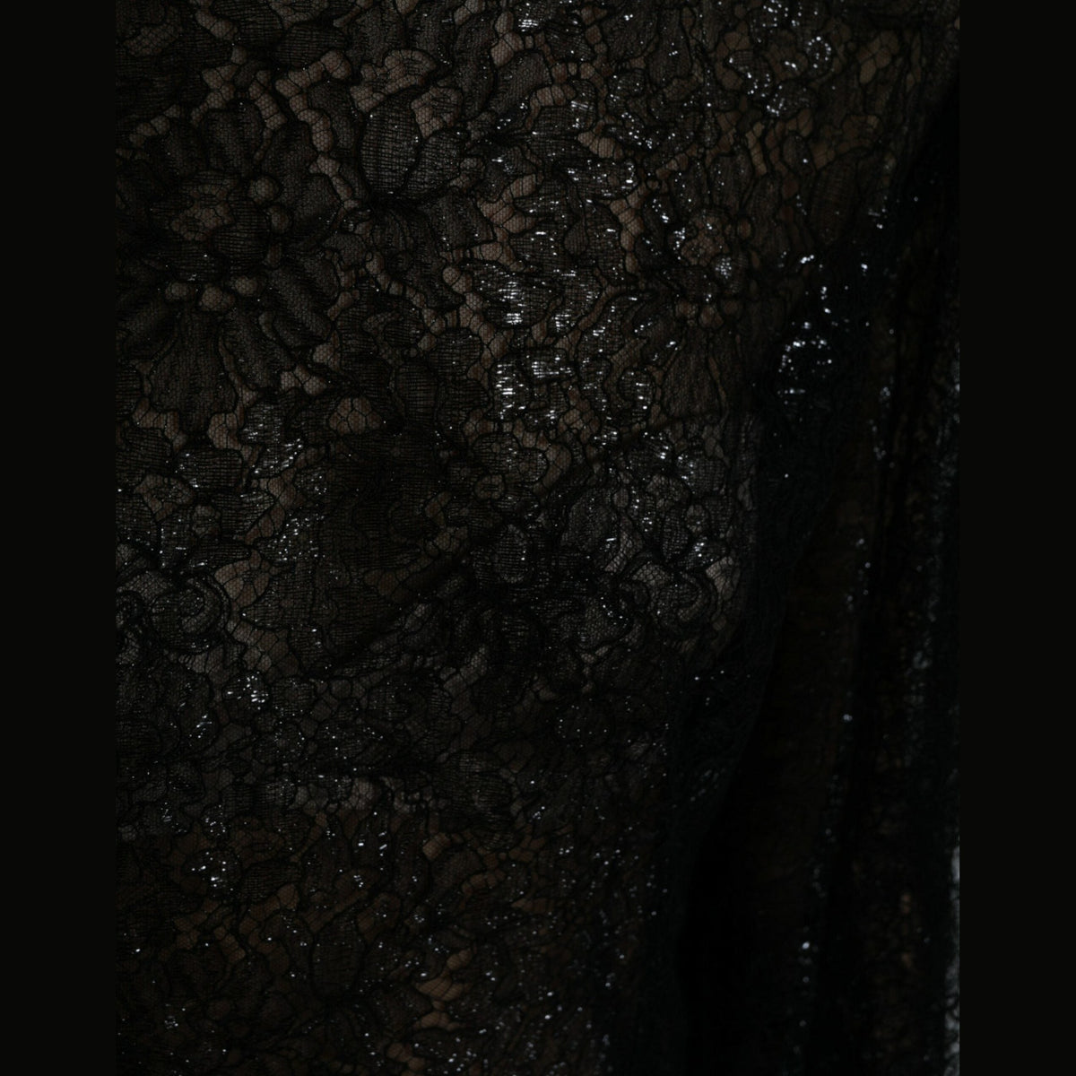 Black floral lace Dolce & Gabbana A-line midi dress with sheer fabric and elegant floral details, perfect for formal occasions.