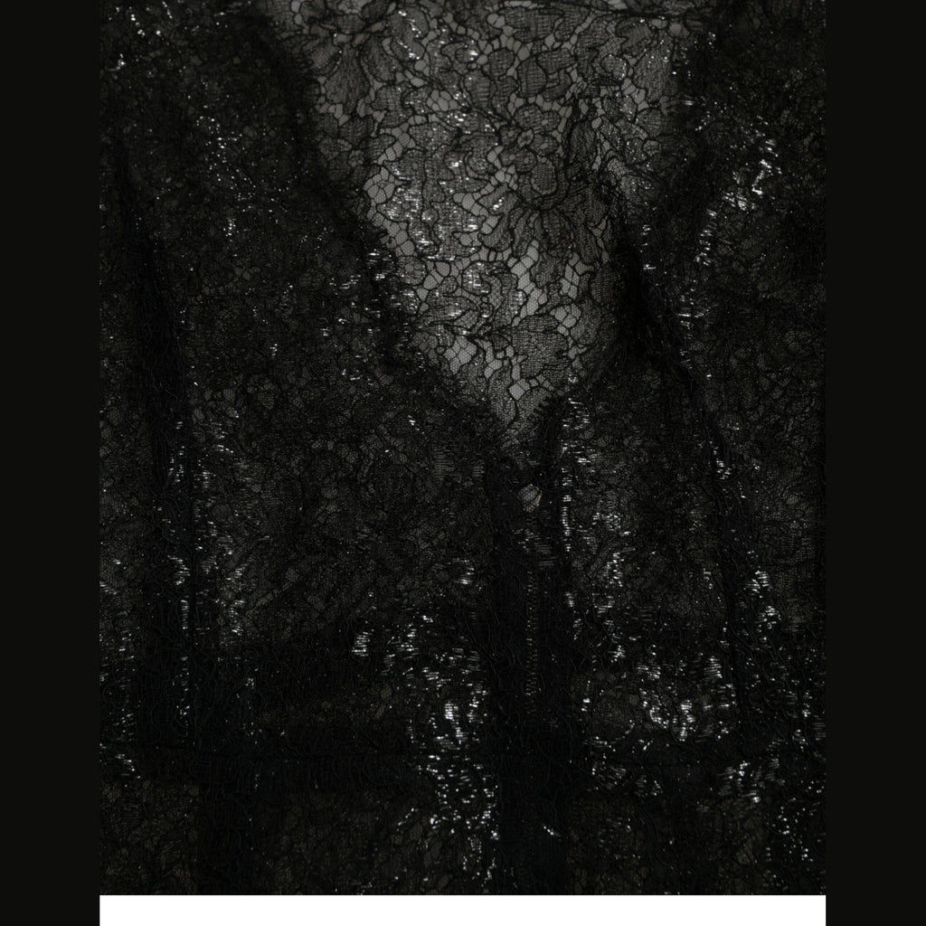 Black floral lace sheer A-line midi dress by Dolce & Gabbana with intricate lace details and a flowing silhouette.