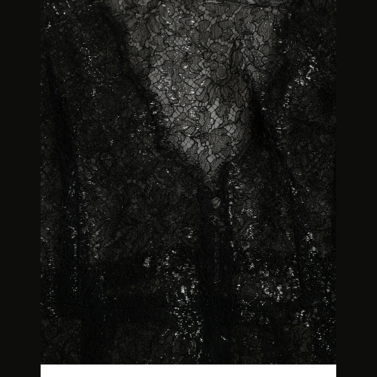 Black floral lace sheer A-line midi dress by Dolce & Gabbana with intricate lace details and a flowing silhouette.