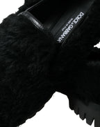 Dolce & Gabbana black fur leather slippers dress shoes with sleek design and luxurious fur trim on a plain background.