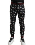 Dolce & Gabbana black silk jogging trousers with a relaxed fit and elastic waistband, stylish and comfortable for casual wear.