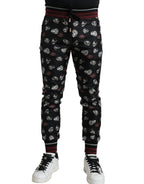 Dolce & Gabbana black silk jogging trousers with a relaxed fit and elastic waistband, stylish and comfortable for casual wear.