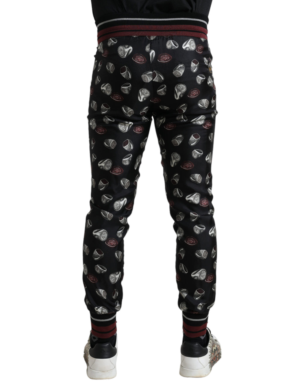 Dolce & Gabbana black silk jogging trousers with a relaxed fit and elastic waistband, stylish and comfortable for casual wear.
