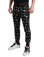 Dolce & Gabbana black silk jogging trousers with a relaxed fit and elastic waistband, stylish and comfortable for casual wear.