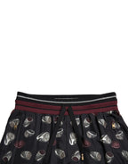 Dolce & Gabbana black silk jogging trousers with relaxed fit and elastic waistband, stylish and comfortable for casual wear.