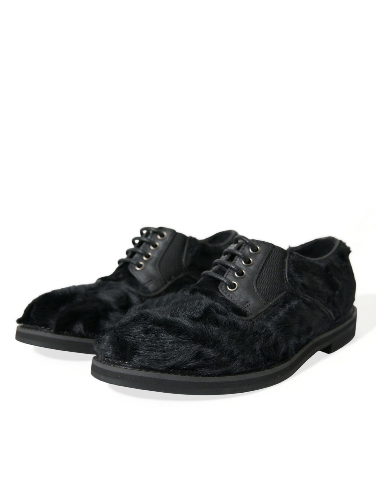 Black leather lace-up derby dress shoes with fur accents by Dolce & Gabbana, featuring a polished finish and classic design.