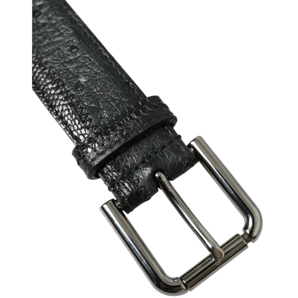 Dolce & Gabbana black exotic leather belt with silver metal buckle, showcasing luxurious textured leather and sleek design.