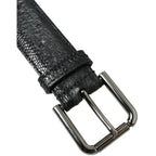 Dolce & Gabbana black exotic leather belt with silver metal buckle, showcasing luxurious textured leather and sleek design.
