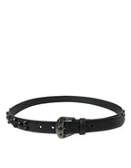 Dolce & Gabbana black leather belt with embellished engraved buckle, stylish accessory with detailed metalwork.