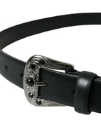 Dolce & Gabbana black leather belt with embellished engraved buckle and detailed design.