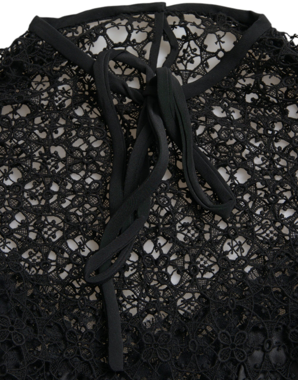 Dolce & Gabbana black floral lace short-sleeve blouse with delicate detailing and elegant fit.