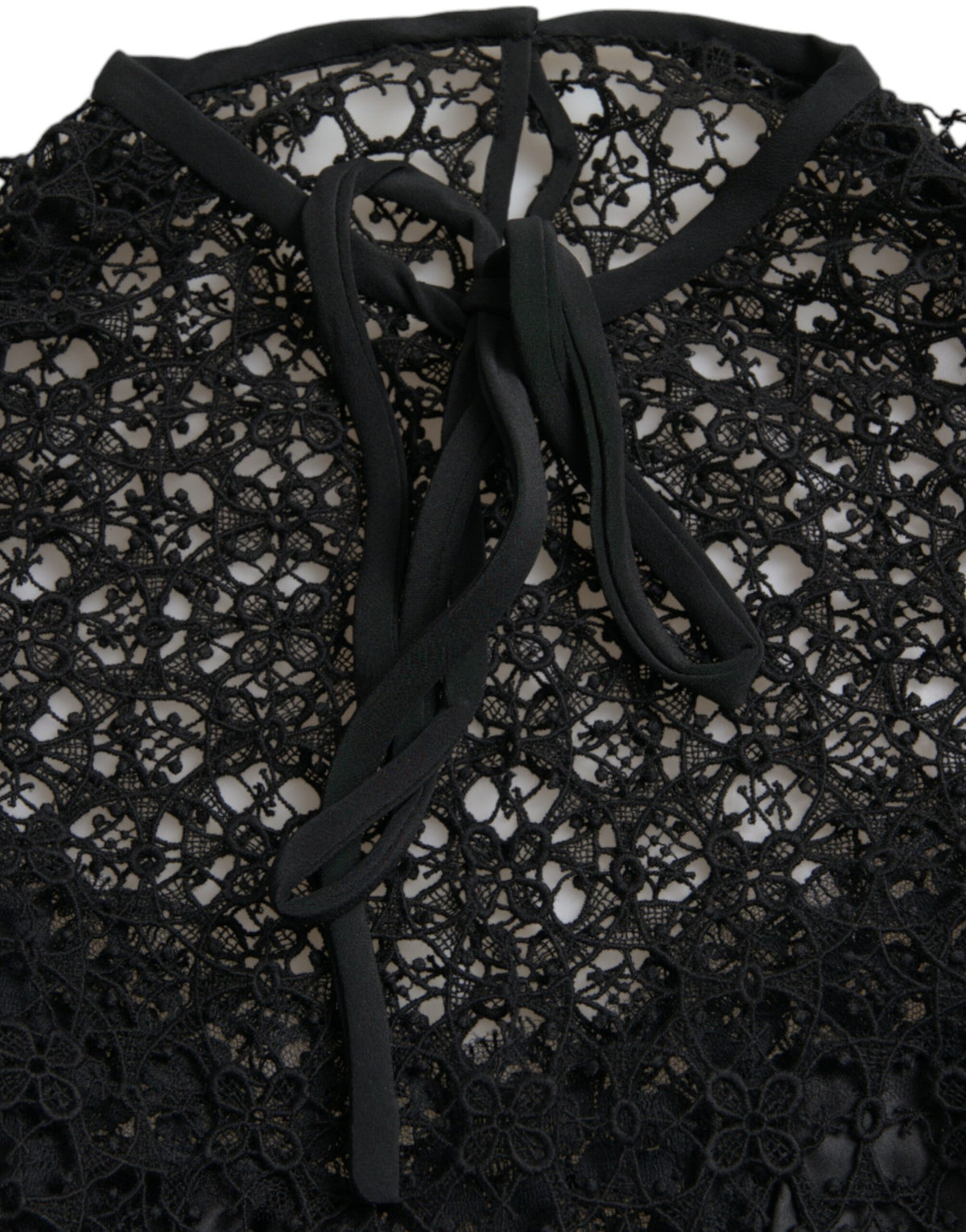 Dolce & Gabbana black floral lace short-sleeve blouse with delicate detailing and elegant fit.