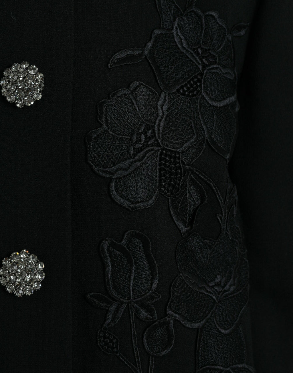 Dolce & Gabbana black floral wool jacket with button embellishments, featuring a stylish and elegant design.