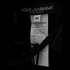 Dolce & Gabbana black floral Ricamo sheath long dress with intricate embroidery and elegant fit, displayed on a mannequin.