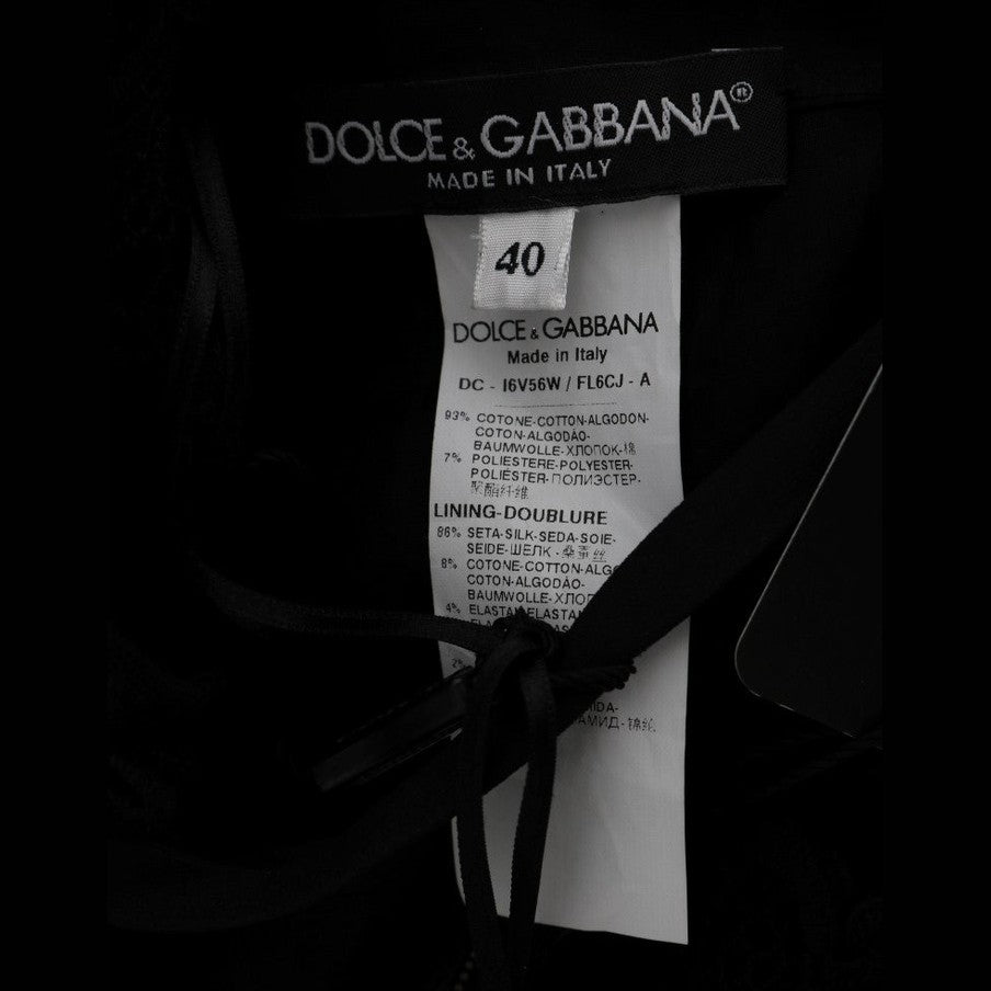 Dolce & Gabbana black floral Ricamo sheath long dress with intricate embroidery and elegant fit, displayed on a mannequin.