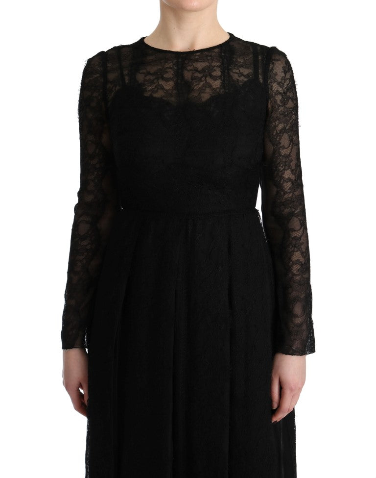 Dolce & Gabbana black floral lace sheath silk dress displayed on a hanger with intricate lace detailing and a fitted silhouette.