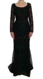 Dolce & Gabbana black floral sheath dress displayed on a hanger, showcasing elegant floral pattern and fitted silhouette.