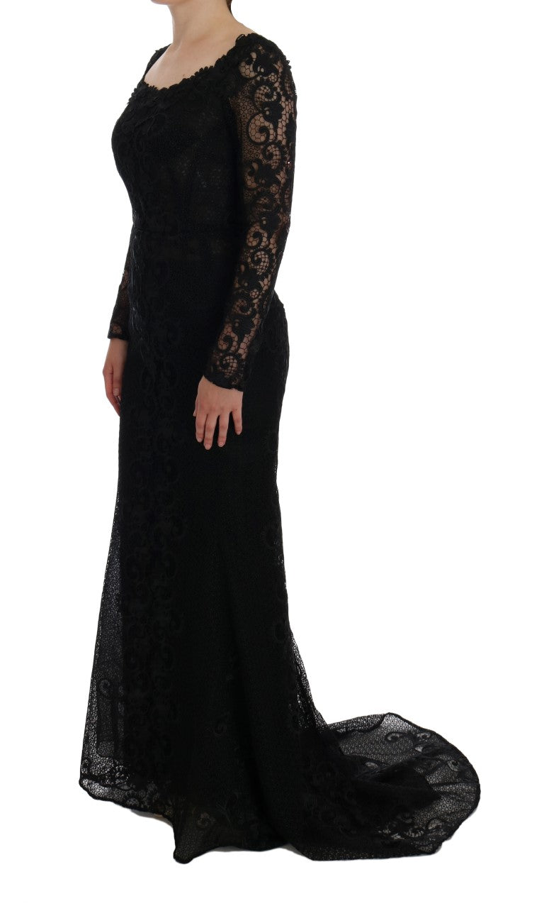 Dolce & Gabbana black floral sheath dress displayed on a mannequin, showcasing elegant design and vibrant floral pattern.
