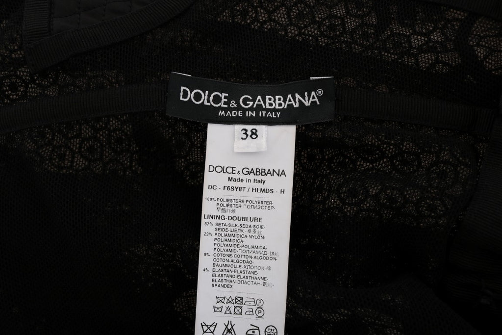 Dolce & Gabbana black floral sheath dress displayed on a hanger with detailed floral pattern and fitted silhouette.