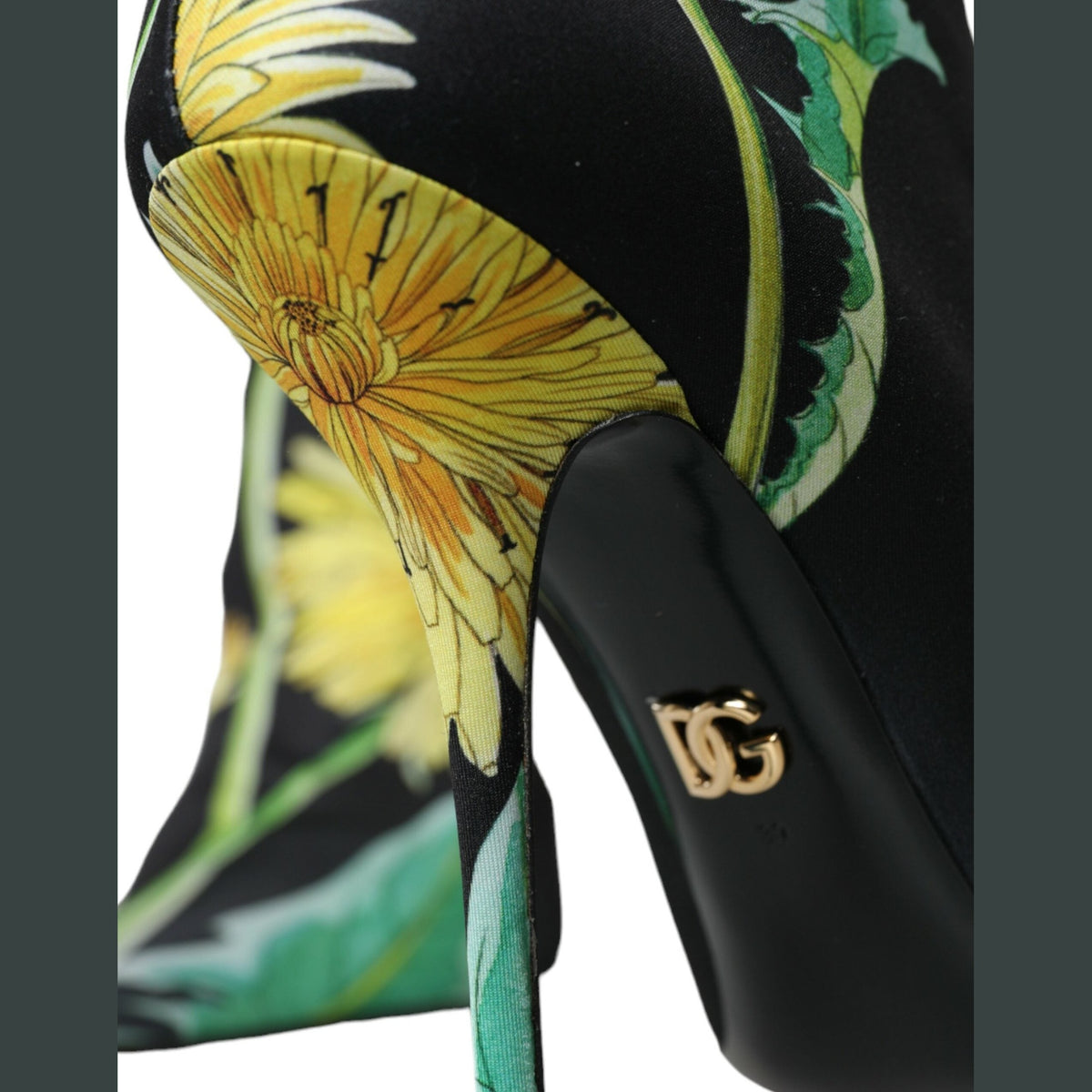 Black floral Dolce & Gabbana jersey stretch ankle boots with sleek design and pointed toes.