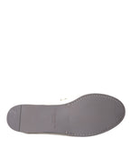 Dolce & Gabbana white and gray leather slip moccasin shoes with loafer style and detailed stitching.