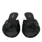 Black exotic leather Dolce & Gabbana heels slides shoes with sleek design and pointed toe, showcasing luxurious footwear style.