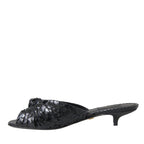 Dolce & Gabbana black exotic leather slide heels with open toe and sleek design.