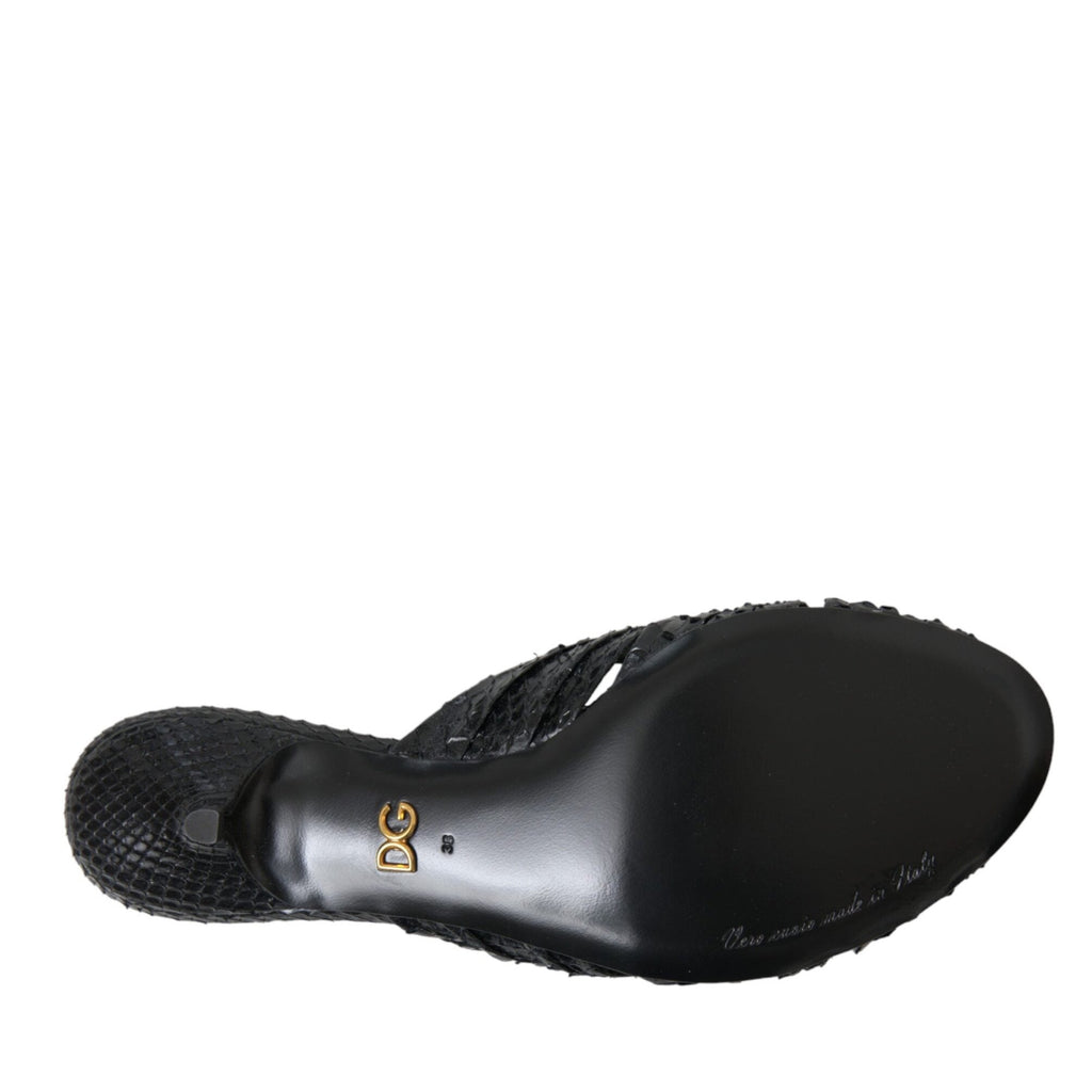 Dolce & Gabbana black exotic leather slide heels with pointed toes and sleek design, perfect for stylish footwear.