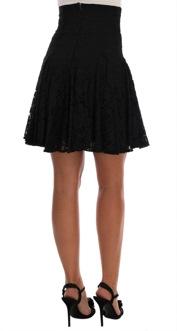 Dolce & Gabbana black floral lace cutout A-line skirt with intricate floral patterns and elegant silhouette.